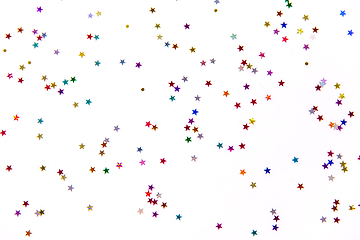 Image showing star shaped glitters on white background