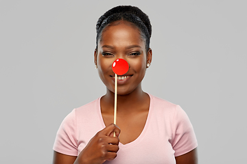Image showing happy african american woman with red clown nose