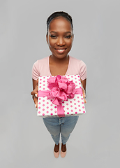 Image showing happy african american woman with gift box