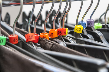 Image showing Hangers in a Clothes Shop