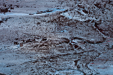 Image showing Texture of the concrete wall. Blue and black colors. 