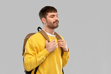 Image showing sad unhappy young man with backpack