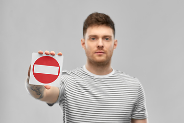 Image showing young man showing stop sign