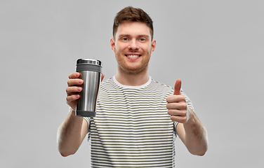 Image showing man with thermo cup or tumbler for hot drinks