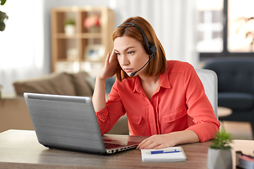 Image showing sad woman with headset and laptop working at home