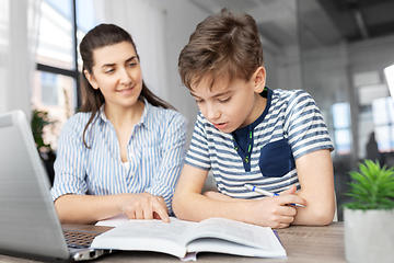 Image showing mother and son doing homework together