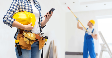 Image showing woman or builder with phone and working tools