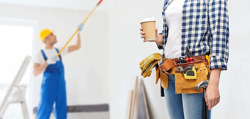 Image showing woman with takeaway coffee cup and working tools