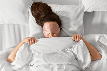 Image showing woman with eye sleeping mask in bed under blanket