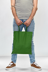 Image showing man with reusable canvas bag for food shopping