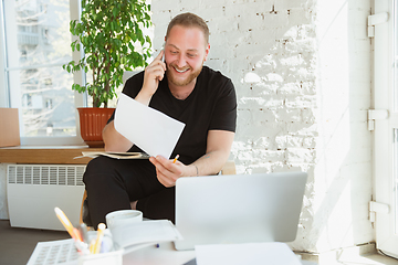 Image showing Young man studying at home during online courses for managers, marketers, buyers