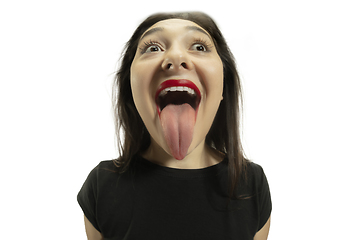 Image showing Smiling girl opening her mouth with red lips and showing the long big giant tongue isolated on white background, crazy and attracted