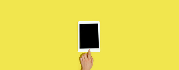 Image showing Hand using gadgets, device on top view, blank screen with copyspace, minimalistic style, flyer