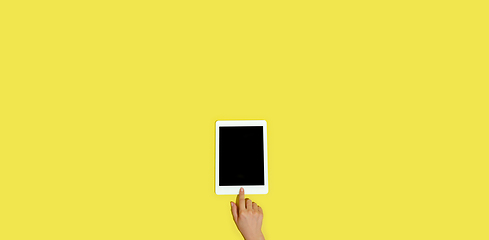 Image showing Hand using gadgets, device on top view, blank screen with copyspace, minimalistic style, flyer