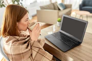 Image showing sick woman with tea having video call on laptop