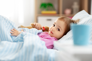 Image showing little girl lying in bed at home