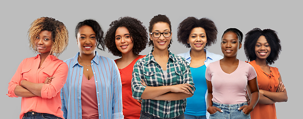 Image showing happy african american women over grey background