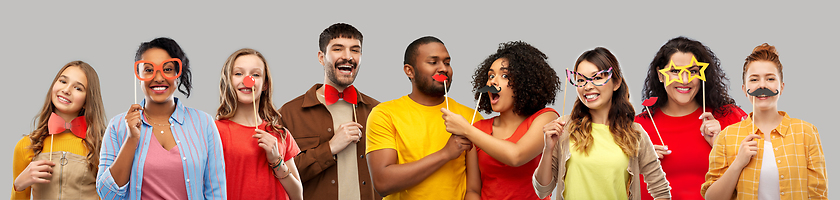 Image showing happy smiling people with party props