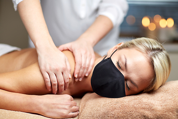 Image showing close up of woman lying and having massage in spa