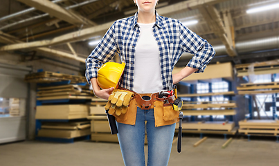 Image showing female worker with helmet and tools at factory