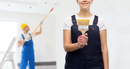 Image showing close up of painter or builder with paint brush