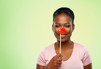 Image showing happy african american woman with red clown nose