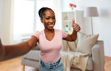 Image showing african woman taking selfie and showing thumbs up