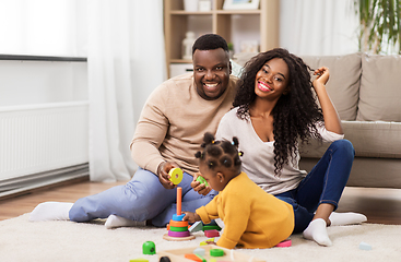 Image showing african family playing with baby daughter at home