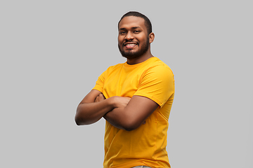 Image showing smiling african american man with crossed arms