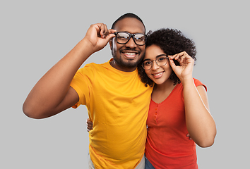 Image showing happy african american couple in glasses hugging