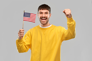 Image showing happy laughing man with flag of america