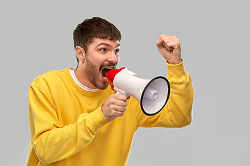 Image showing angry man shouting to megaphone