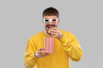 Image showing smiling man 3d movie glasses eating popcorn