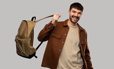 Image showing happy smiling young man in glasses with backpack