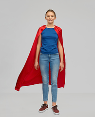 Image showing smiling teenage girl in red superhero cape