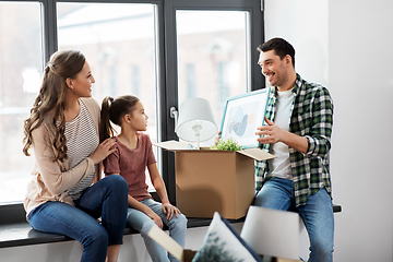 Image showing happy family with child moving to new home