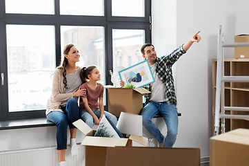 Image showing happy family with child moving to new home