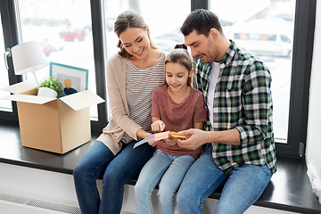 Image showing happy family with color palette moving to new home