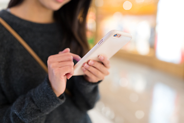 Image showing Woman working on mobile phone