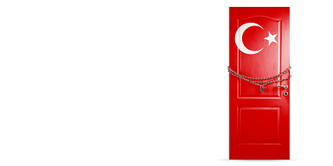 Image showing Door colored in Turkey flag, locking with chain. Countries lockdown during coronavirus, COVID spreading