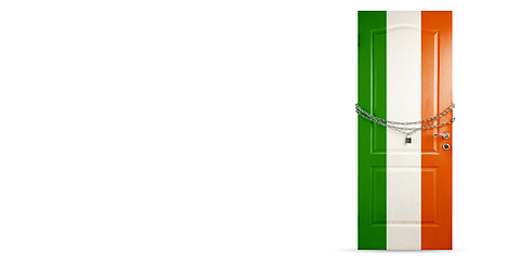 Image showing Door colored in Ireland flag, locking with chain. Countries lockdown during coronavirus, COVID spreading