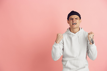 Image showing Caucasian young man\'s modern portrait on pink studio background