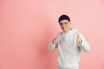 Image showing Caucasian young man\'s modern portrait on pink studio background