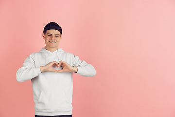 Image showing Caucasian young man\'s modern portrait on pink studio background