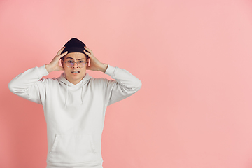 Image showing Caucasian young man\'s modern portrait on pink studio background