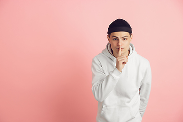 Image showing Caucasian young man\'s modern portrait on pink studio background