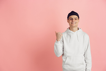 Image showing Caucasian young man\'s modern portrait on pink studio background