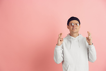 Image showing Caucasian young man\'s modern portrait on pink studio background