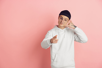 Image showing Caucasian young man\'s modern portrait on pink studio background