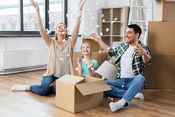 Image showing happy family playing with foam peanuts at new home